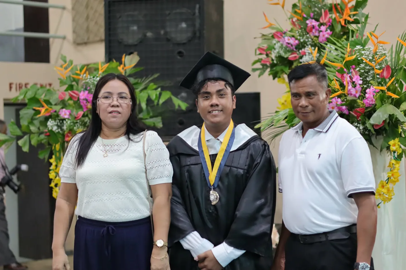 With my parents on graduation day